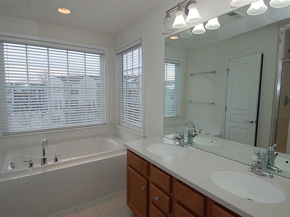 Dual vanity and soaking tub.