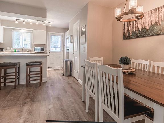 Dining room area with kitchen in the back.