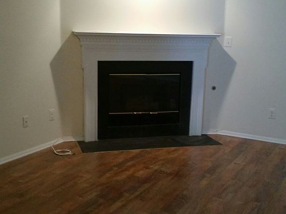 Living room with fireplace and sliders out to private patio