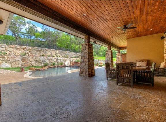 Fantastic outdoor living at its finest, including an incredible built-in outdoor kitchen! Bring on the football!