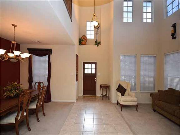 Formal living and dining room to each side of the dramatic 2 story entry