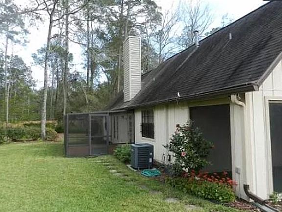 Back of house with smaller and larger screen porches