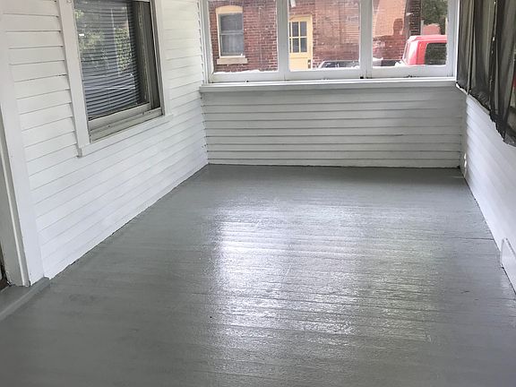 Screened in front porch. Can fit several chairs or a couch. Dimensions: 15x7ft