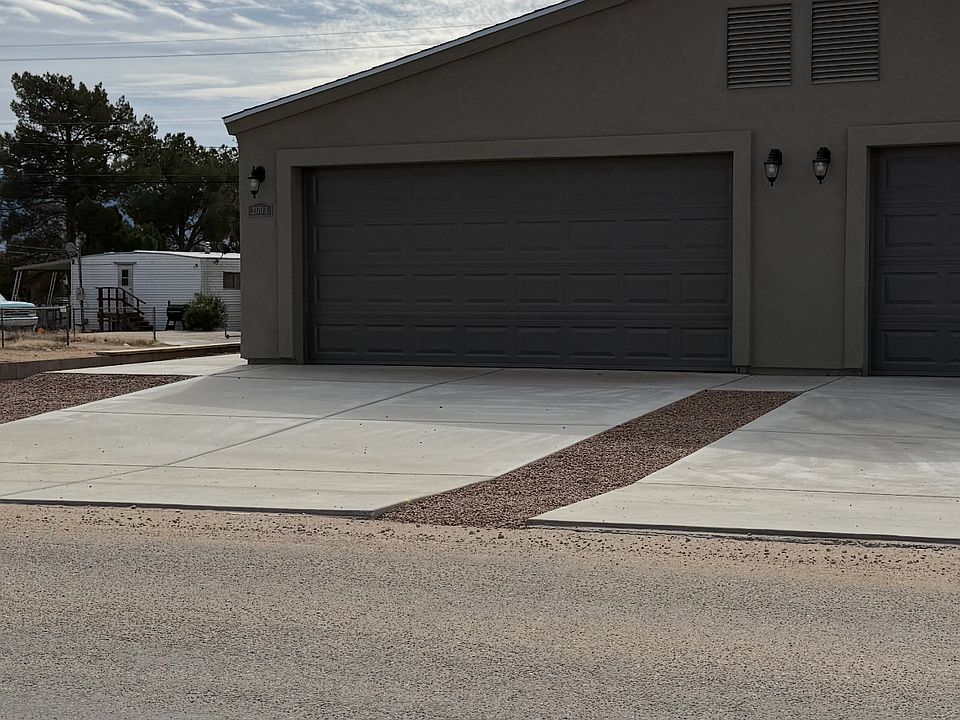 Front of Duplex driveway & garage