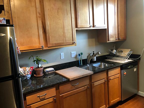 Kitchen Sink with Granite Countertops and Large Cabinets