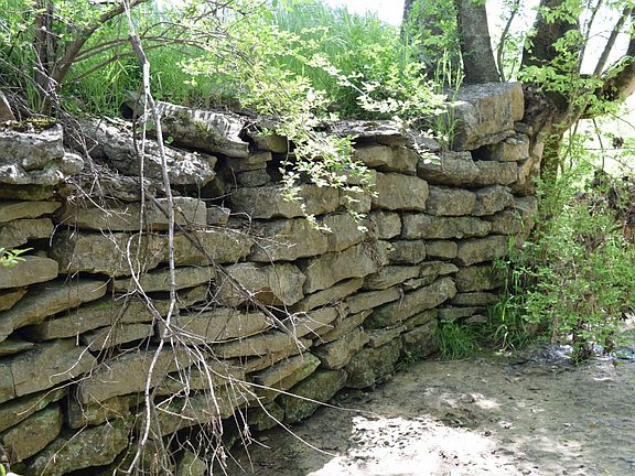 Old stone wall along the creek.