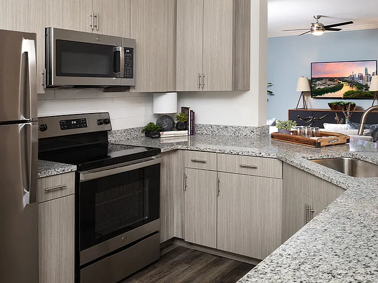 Modern kitchens with upgraded stainless steel appliances and premium granite countertops
