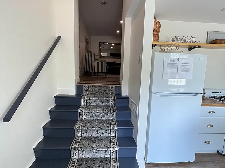 Steps leading up to living room and bedroom area