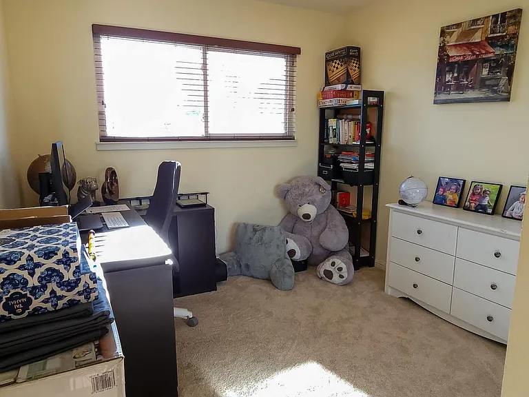 Office room/ bedroom 4 with carpets before which have now been replaced with wooden flooring