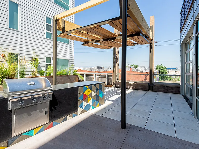 Rooftop deck with plush seating areas, great views, and outdoor TV