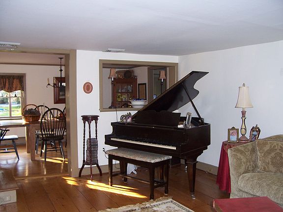 Living room is large enough for a baby grand piano