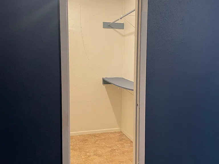 Walk in closet in master bedroom.