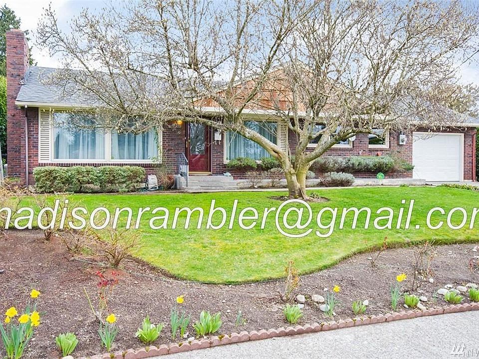 Beautiful Clinker Brick Rambler. Shingle and trim paint updated since photo taken.