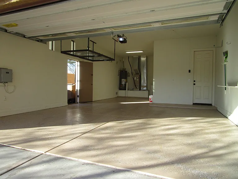 3 car garage with upgraded epoxy floor