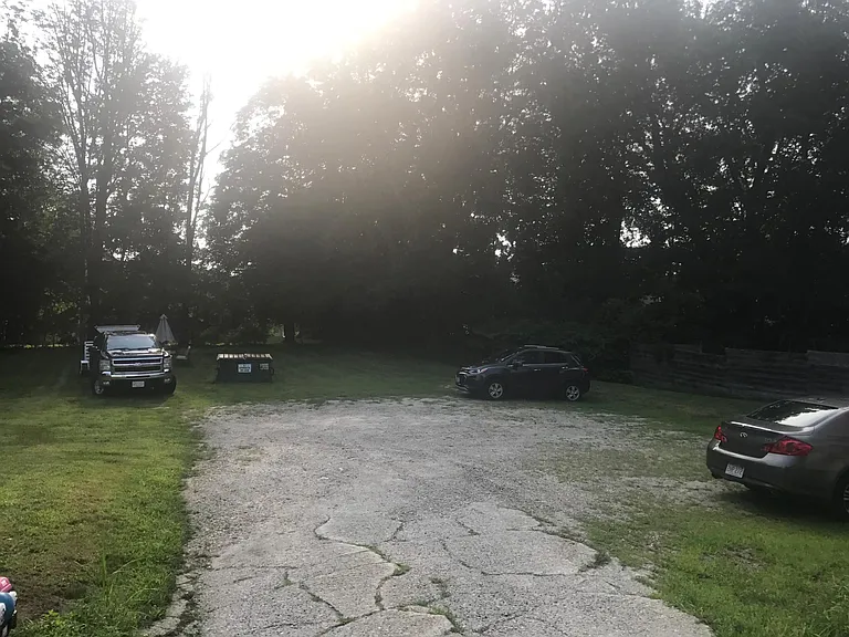 View from the driveway towards the off-street parking and yard.
