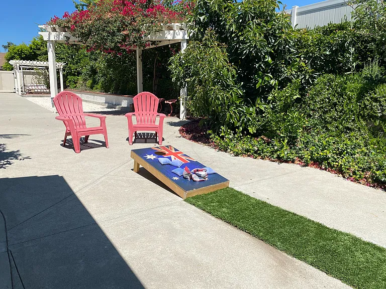 Challenge your crew to a friendly game of cornhole in the backyard fun zone!