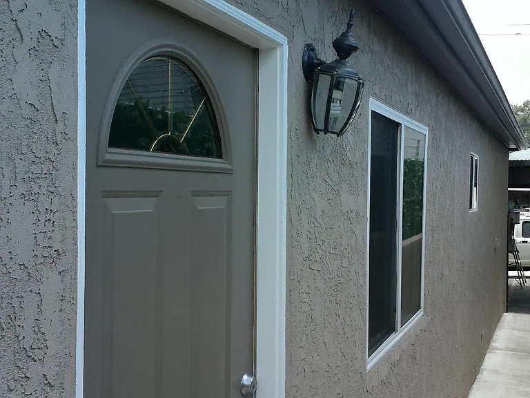 Front door & shot facing alley. This is the last building closest to alley. Security gates.