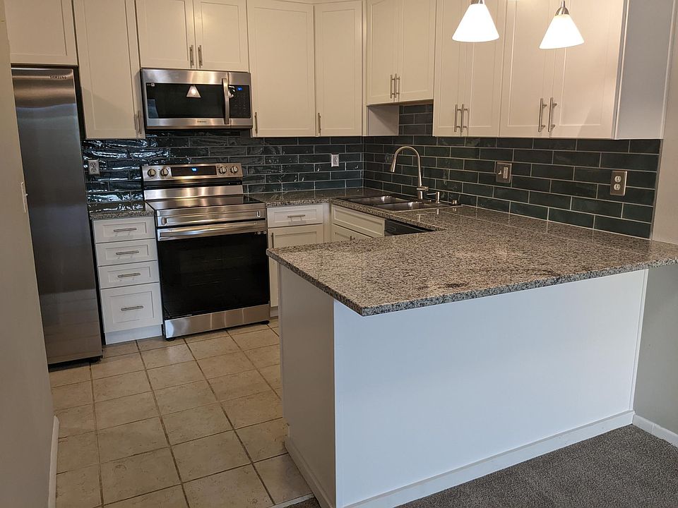 Brand new kitchen with new cabinets, appliances, and granite counter tops.
