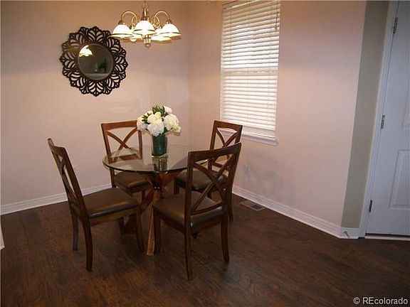 Dining nook off the main entrance with a dimmable chandelier