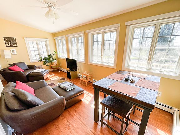 The sunroom is where we love to hang out - reading or watching Netflix from the leather loveseats, or having a snack at the table.