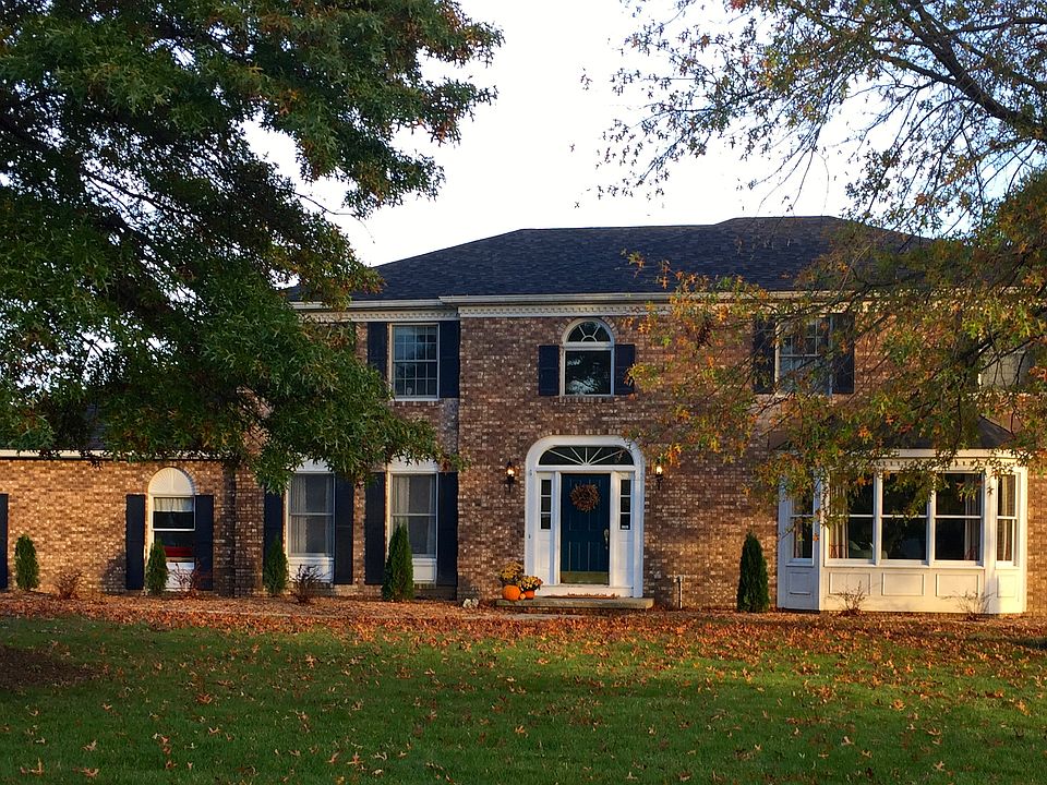 Wide yard and brick facade
