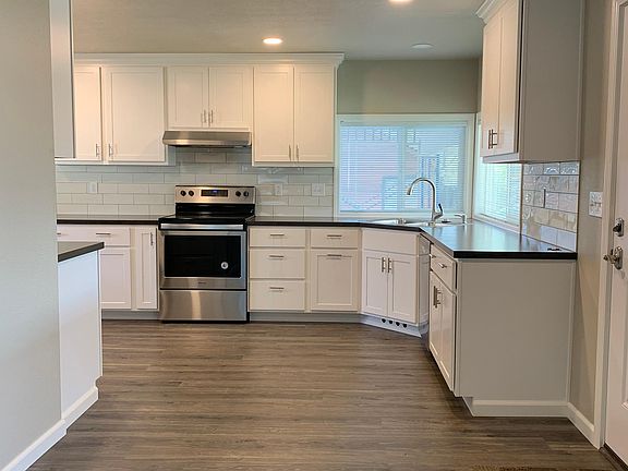 Front door entry, dining area, entry into kitchen from Living Room.