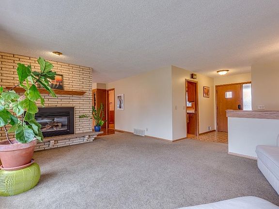 Spacious entry (with coat closet) flows directly into the south-facing living room.