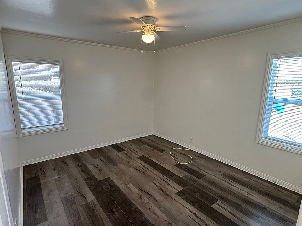 Bedroom from the bedroom entrance viewpoint. Includes 2 newly replaced windows & ceiling fan