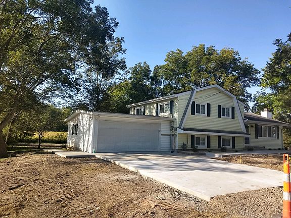 CONCRETE DRIVE AND SIDE WALK. 2 CAR GARAGE.