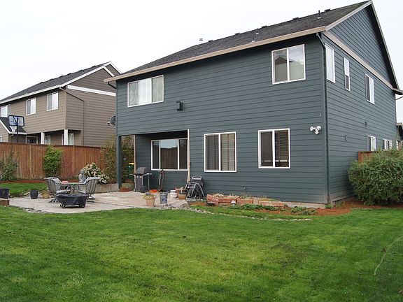 Large back yard with 2 patio areas and garden shed