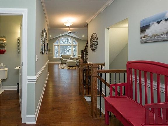 Entering the wide foyer youll be greeted by the sleek hardwood flooring and the two story picture window.