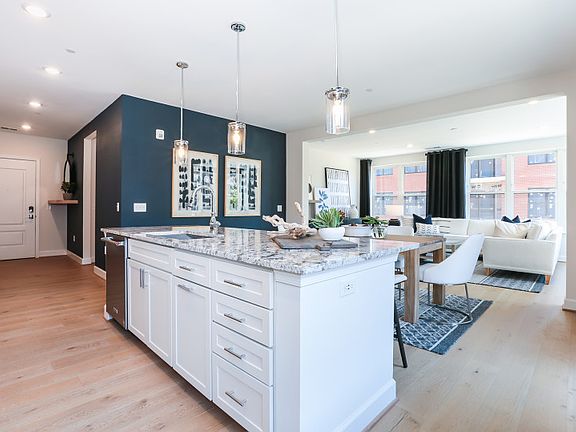 Model Representation - Kitchen Overlooks Dining Room and Living Room.