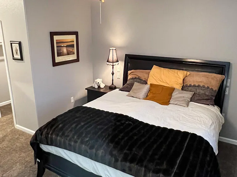 Bedroom1 bed and nightstand.