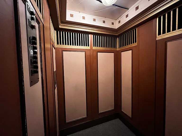 The inside of the building's only elevator.