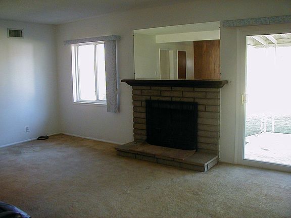 Large living room with Fireplace opens to back yard