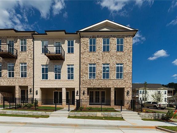 Example of. Each unit has a fenced in yard.