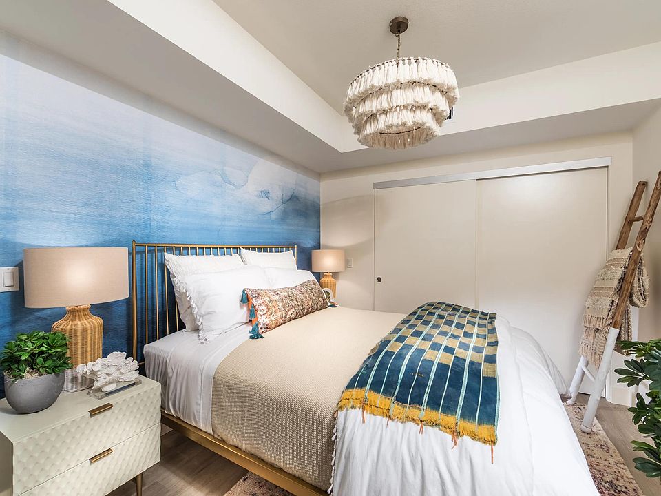 Primary bedroom featuring expansive closet space and spa_inspired bathroom access.