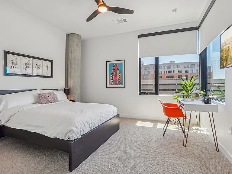 Spacious bedroom with ceiling fan