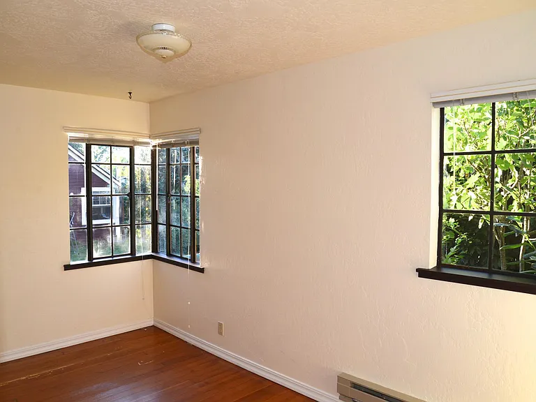 The other end of the office with corner wrap-around windows.