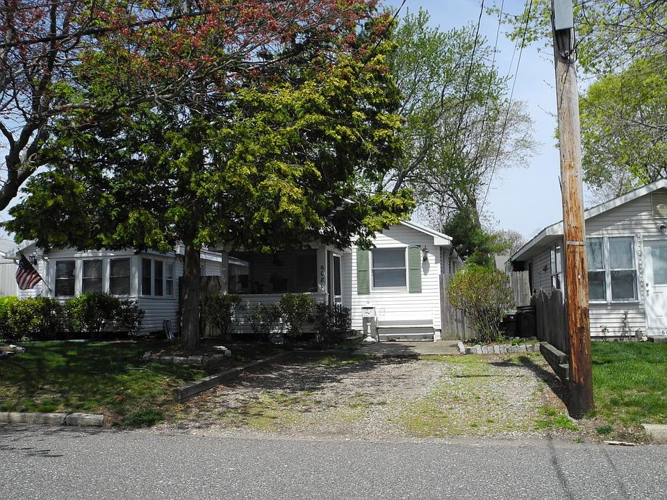 Cottage w/ front porch, parking for two cars. 6 blocks to be