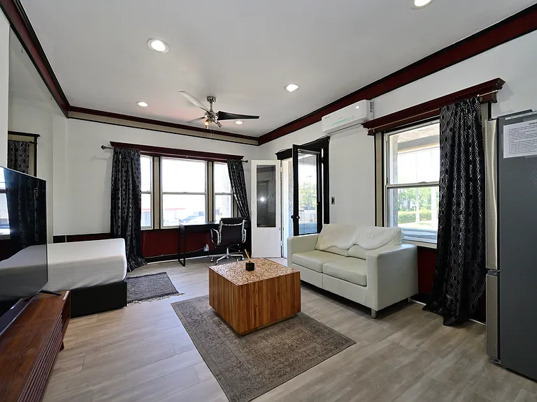 Fully Furnished & Updated LARGE and BRIGHT Studio w/ in-unit laundry + private balcony + parking