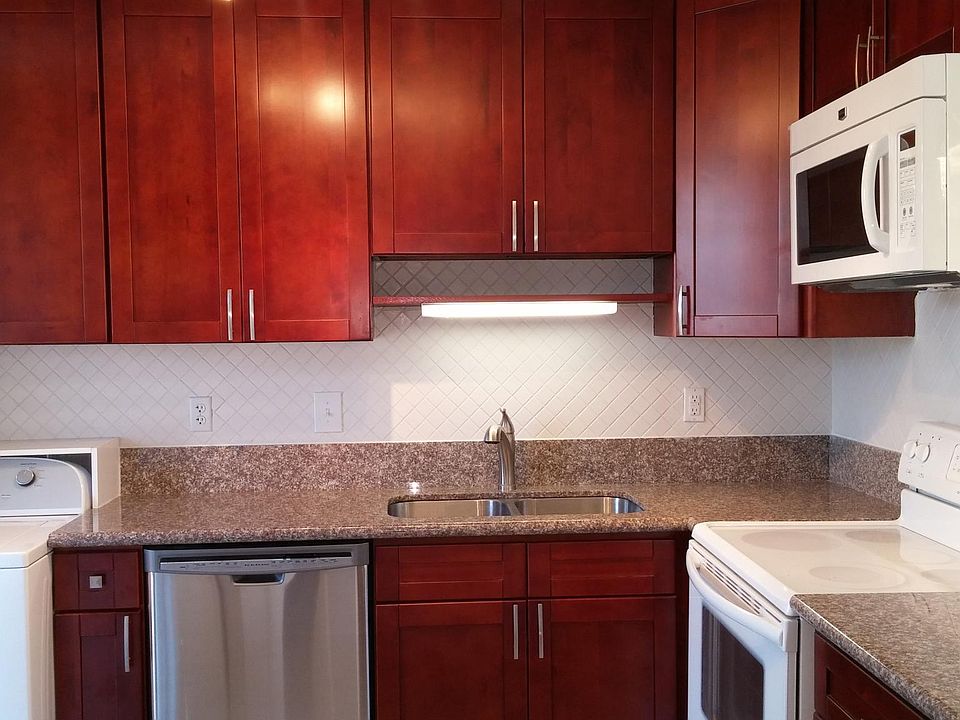 Beautiful cherry colored cabinetry.