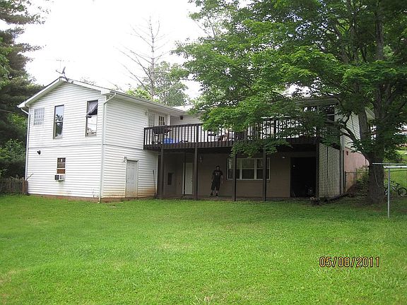 view of back of house. more yard work & outside of house painting in progress