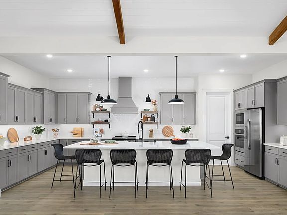 Kitchen with spacious island and pendant lighting
