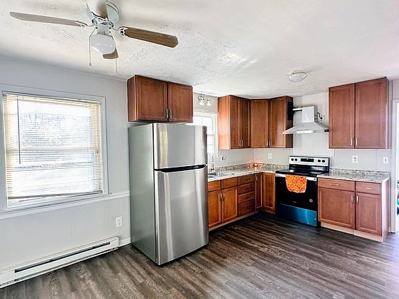 Newly renovated kitchen cabinets, laminate flooring and appliances