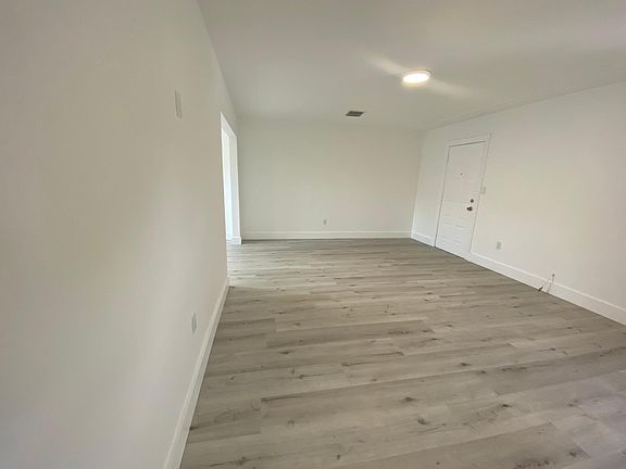 Living Room with front door entrance.