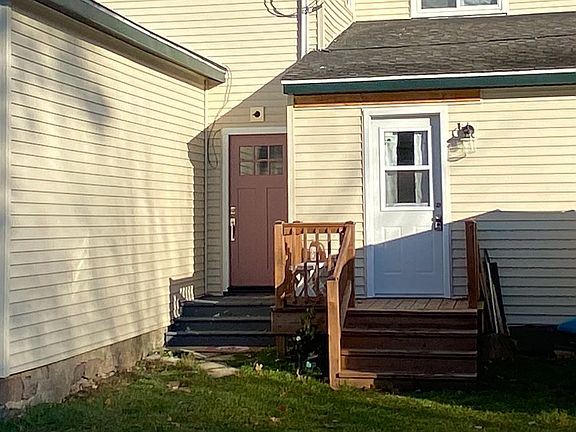 Entry door purple on left to upstairs unit
