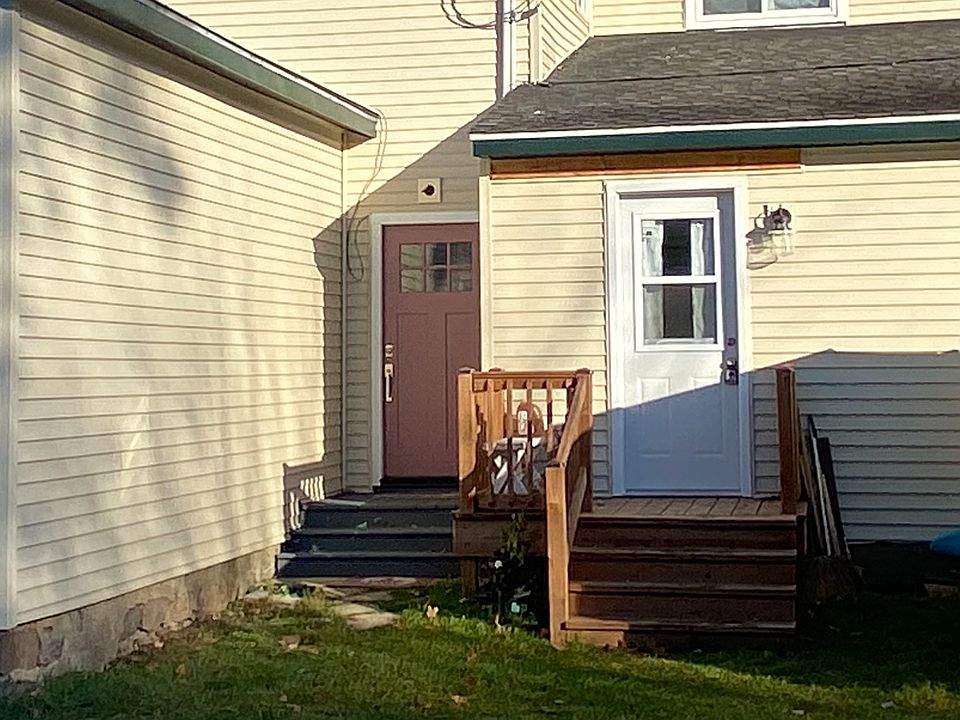 Entry door purple on left to upstairs unit
