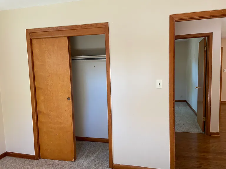 Bedroom 2 at rear of home with view to hallway