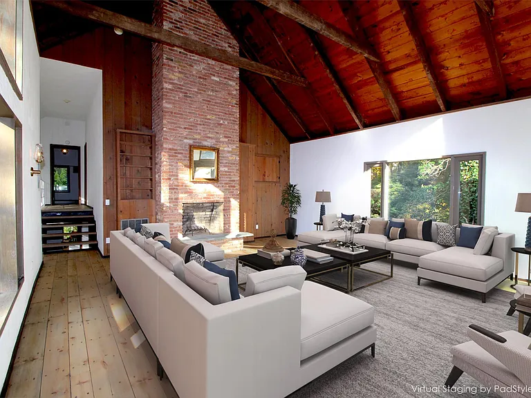 Virtually staged. Massive Great Room with majestic Fireplace and Cathedral Ceiling.